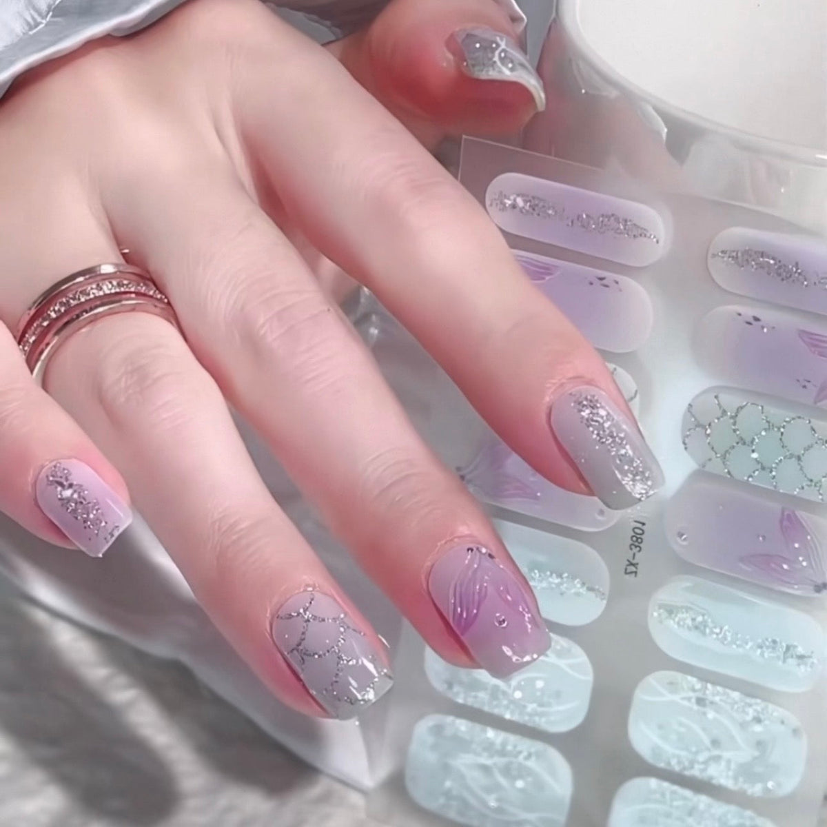 Hand with POP Claw nails wraps